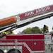 Ann Arbor firefighters work on top of a ladder truck while at the scene of a morning fire at an empty apartment complex in the 1500 block of Pauline on Saturday. Melanie Maxwell I AnnArbor.com
